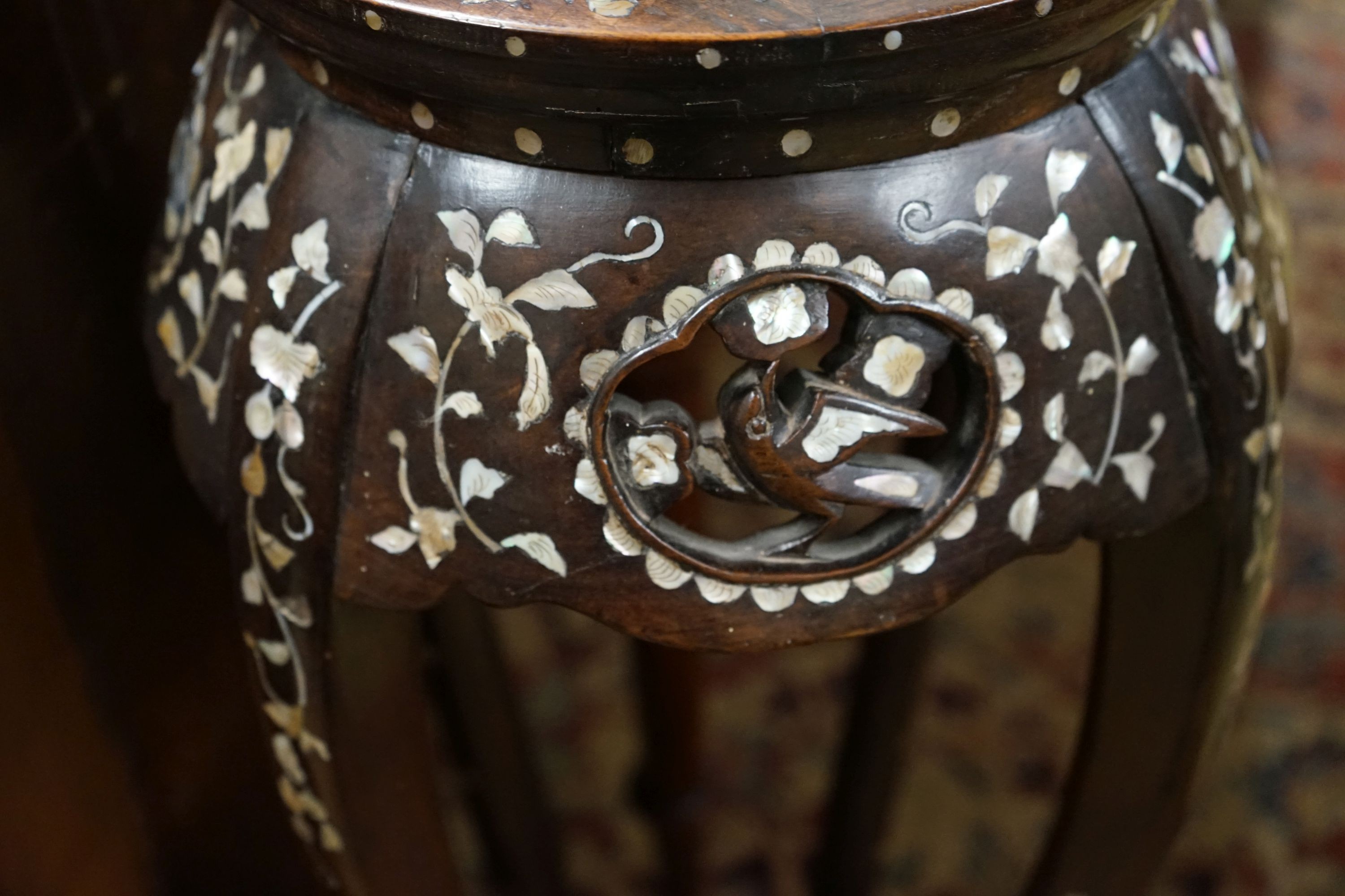 A pair of Chinese mother of pearl inset hardwood vase stands, height 92cm